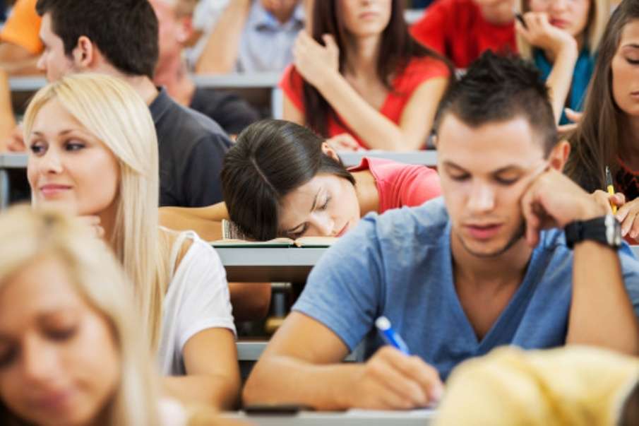 Young female student sleeping during a lecture.